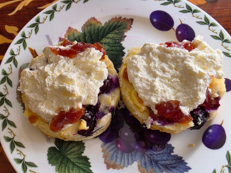Freshly baked blueberry scones with cream and strawberry jam served by Ms-B Cake Boutique